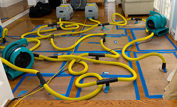 Professional Storm Water Damage Restoration technician working in Hubertus, WI